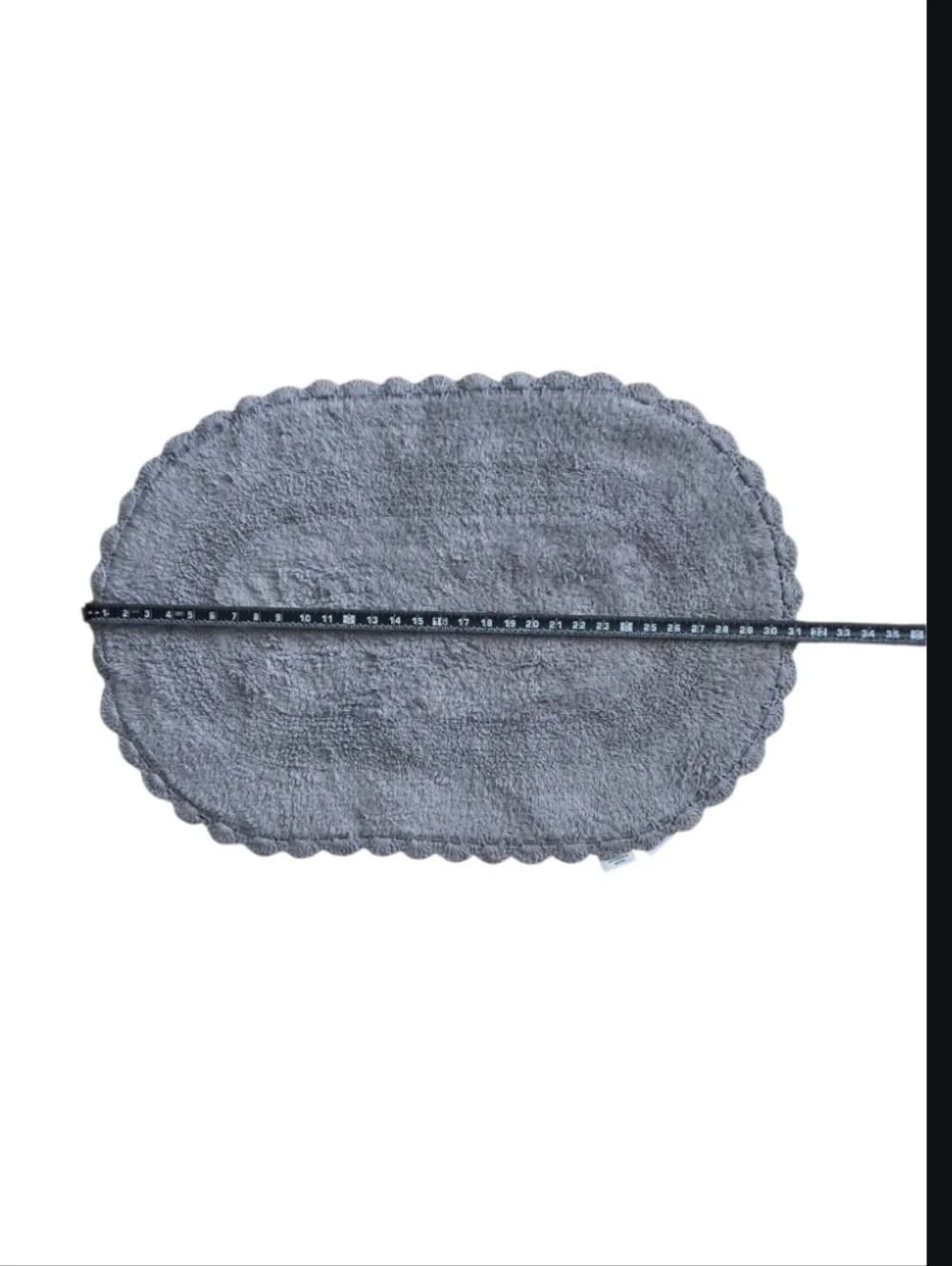 2-piece set of oval cotton bath rugs featuring a crochet border